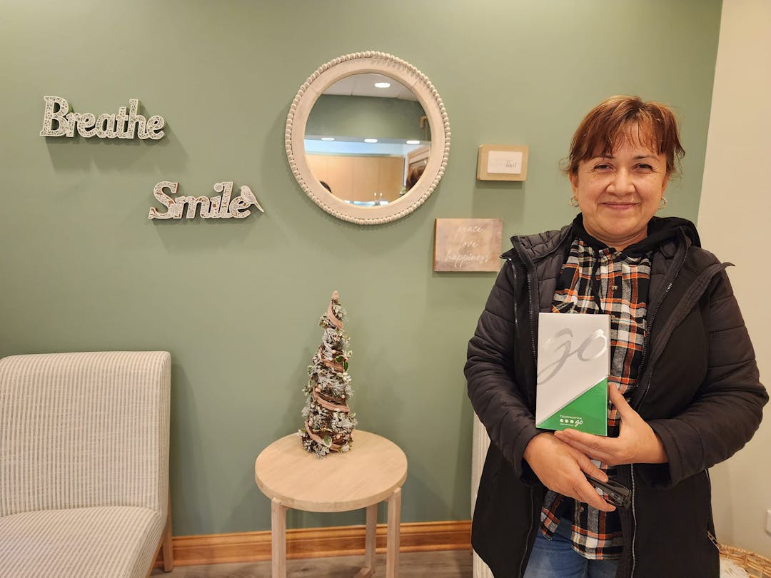 Crystal Cove Family Dental Patient Smiling in Lobby