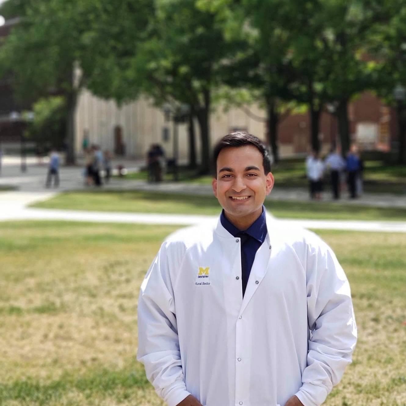 Dr. Kunal Bector in his University of Michigan white coat